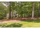 Beautiful home surrounded by mature trees, offering a sense of privacy and tranquility at 5581 Fox Glove Ct, Douglasville, GA 30135