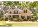 Charming two-story home with manicured landscaping and a welcoming front porch at 5581 Fox Glove Ct, Douglasville, GA 30135