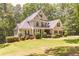 Beautiful two-story home with a well-maintained lawn and mature trees at 5581 Fox Glove Ct, Douglasville, GA 30135