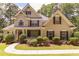 Charming two-story home with manicured landscaping and a welcoming front porch at 5581 Fox Glove Ct, Douglasville, GA 30135