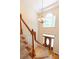 Bright foyer features hardwood floors, a staircase, and a chandelier at 5581 Fox Glove Ct, Douglasville, GA 30135