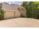 Spacious three-car garage offering ample parking and storage space at 5581 Fox Glove Ct, Douglasville, GA 30135