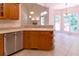 Bright kitchen with stainless steel appliances and wood cabinets at 5581 Fox Glove Ct, Douglasville, GA 30135