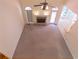 Bright open living room with carpet flooring and a stone fireplace, offering a spacious and inviting atmosphere at 5581 Fox Glove Ct, Douglasville, GA 30135