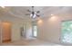 Large main bedroom with tray ceiling and neutral carpeting at 5581 Fox Glove Ct, Douglasville, GA 30135