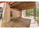 View of a patio with concrete floor beneath a wooden deck with house access, and a view to the yard at 5581 Fox Glove Ct, Douglasville, GA 30135