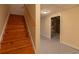 Staircase leading to the basement and a doorway to the utility area at 5581 Fox Glove Ct, Douglasville, GA 30135