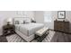Stylized bedroom with light-colored walls, luxury vinyl flooring, and contemporary furniture at 7301 Cranleigh St, Covington, GA 30014