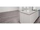 Modern kitchen with granite countertop island, stainless steel appliances, and open space for entertaining at 7301 Cranleigh St, Covington, GA 30014