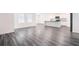 Open-concept living area with modern flooring, and a bright, airy ambiance at 7301 Cranleigh St, Covington, GA 30014