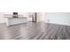 Open-concept living area with modern flooring, and a bright, airy ambiance at 7301 Cranleigh St, Covington, GA 30014