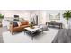 Stylish living room featuring modern decor, sleek flooring, and an open layout at 7301 Cranleigh St, Covington, GA 30014