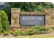 Community sign for Ashford Park, highlighting the neighborhood's entrance with stone masonry at 7301 Cranleigh St, Covington, GA 30014
