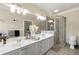 Bathroom featuring a double vanity, a glass shower, bright lighting and decor at 3642 Princeton Ave, Atlanta, GA 30337