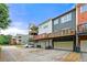 View of townhomes with garages, balconies and varied exterior colors and attached garages at 3642 Princeton Ave, Atlanta, GA 30337