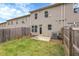 A fenced backyard with a small patio and grassy area, perfect for outdoor enjoyment at 5312 Brooklands Dr, Lithonia, GA 30058