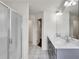 Double sink bathroom with shower and marble floors at 5312 Brooklands Dr, Lithonia, GA 30058