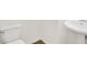 A simple bathroom includes a pedestal sink and toilet at 5312 Brooklands Dr, Lithonia, GA 30058