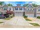 Attractive townhouse with a two-car garage and well-maintained landscaping at 5312 Brooklands Dr, Lithonia, GA 30058
