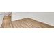 Hallway featuring wood-look flooring, neutral paint, and white trim at 5312 Brooklands Dr, Lithonia, GA 30058