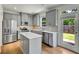 Modern kitchen featuring stainless steel appliances, a center island, and light gray cabinets at 5312 Brooklands Dr, Lithonia, GA 30058