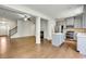 Open concept living area with hardwood floors seamlessly connecting to the kitchen at 5312 Brooklands Dr, Lithonia, GA 30058