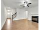 Spacious living room featuring hardwood floors, a fireplace, and staircase at 5312 Brooklands Dr, Lithonia, GA 30058