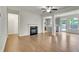 Open living room layout with hardwood floors, a fireplace, and access to the kitchen at 5312 Brooklands Dr, Lithonia, GA 30058