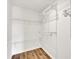 A walk-in closet with shelving and hardwood floors at 5312 Brooklands Dr, Lithonia, GA 30058