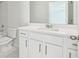Modern bathroom featuring white cabinets and quartz counters at 5816 Creek Indian Dr, Sugar Hill, GA 30518
