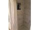 Bathroom featuring a shower with a white tile surround, and a built-in soap niche at 144 Boones Ridge Se Pkwy, Acworth, GA 30102