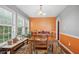 Bright dining room with large windows, a wooden table, and seating for six at 144 Boones Ridge Se Pkwy, Acworth, GA 30102