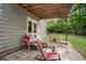 Underground patio with four chairs and exterior house view at 144 Boones Ridge Se Pkwy, Acworth, GA 30102