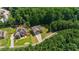 An aerial view showcasing the house and surrounding lush, green landscape at 2015 Chapel Estates Lane Southeast Ln, Dacula, GA 30019