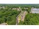 An aerial view capturing the neighborhood layout and the surrounding green spaces at 2015 Chapel Estates Lane Southeast Ln, Dacula, GA 30019