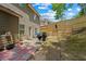 Backyard featuring a small patio with seating and grill, and a wooden privacy fence at 2015 Chapel Estates Lane Southeast Ln, Dacula, GA 30019