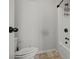 Bathroom features shower with a bathtub and a toilet at 2015 Chapel Estates Lane Southeast Ln, Dacula, GA 30019