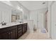 Bathroom featuring double sink vanity, a shower, and separate tub at 2015 Chapel Estates Lane Southeast Ln, Dacula, GA 30019