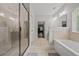 Beautiful bathroom featuring large shower, tub, and modern fixtures at 2015 Chapel Estates Lane Southeast Ln, Dacula, GA 30019