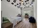 Bedroom featuring hard wood floors and records on the ceiling at 2015 Chapel Estates Lane Southeast Ln, Dacula, GA 30019