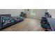 Cozy bedroom with hardwood floors, natural light, desk for work, and bed with space-themed comforter at 2015 Chapel Estates Lane Southeast Ln, Dacula, GA 30019