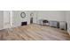 Spacious bedroom with hardwood floors leading to open doorway and including a gray chest of drawers at 2015 Chapel Estates Lane Southeast Ln, Dacula, GA 30019