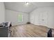 Bright bedroom featuring hardwood floors, vaulted ceiling, two closets and a window with natural light at 2015 Chapel Estates Lane Southeast Ln, Dacula, GA 30019