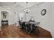 Elegant dining room featuring hardwood floors, trim, and a chandelier at 2015 Chapel Estates Lane Southeast Ln, Dacula, GA 30019