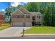 Charming two-story brick home with a well-manicured lawn and a two-car garage at 2015 Chapel Estates Lane Southeast Ln, Dacula, GA 30019