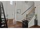 Inviting foyer with hardwood floors, staircase with iron railings, and modern decor at 2015 Chapel Estates Lane Southeast Ln, Dacula, GA 30019