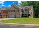 Charming two-story home with brick facade, manicured lawn and two car garage at 2015 Chapel Estates Lane Southeast Ln, Dacula, GA 30019