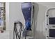 Garage featuring a BMW i electric vehicle charger with cable and charger gun at 2015 Chapel Estates Lane Southeast Ln, Dacula, GA 30019