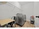 Functional laundry room with modern washer and dryer and plenty of shelving at 2015 Chapel Estates Lane Southeast Ln, Dacula, GA 30019