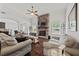 Cozy living room showcasing a stone fireplace, hardwood floors, and neutral tones at 2015 Chapel Estates Lane Southeast Ln, Dacula, GA 30019